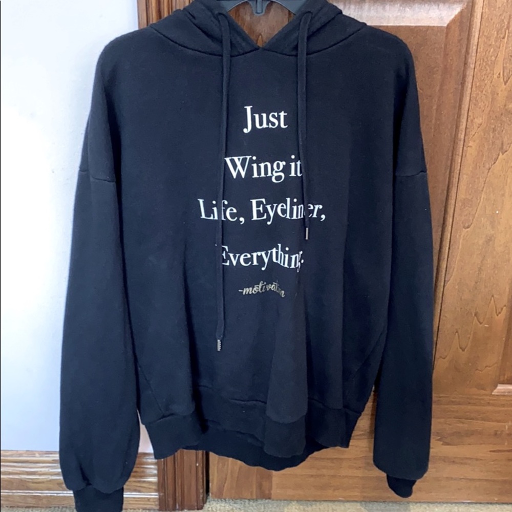 “Just wing it.Life,eyeliner,everything.”Sweatshirt